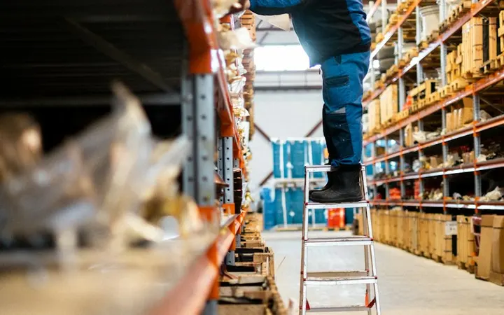 Warehouse aisle with stocked racks